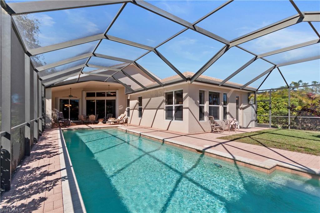 8855 Largo Mar Drive Estero, FL 33967 - Photo 34 of 50 a view of a house with backyard porch and sitting area