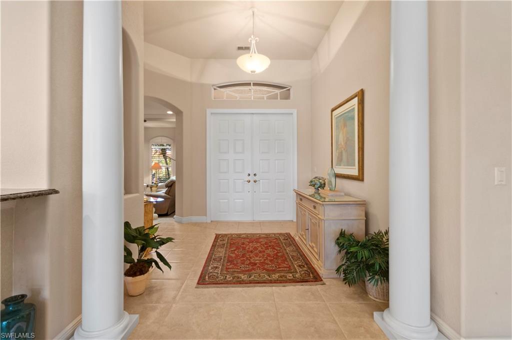 8855 Largo Mar Drive Estero, FL 33967 - Photo 6 of 50 a bathroom with a tub shower and a mirror