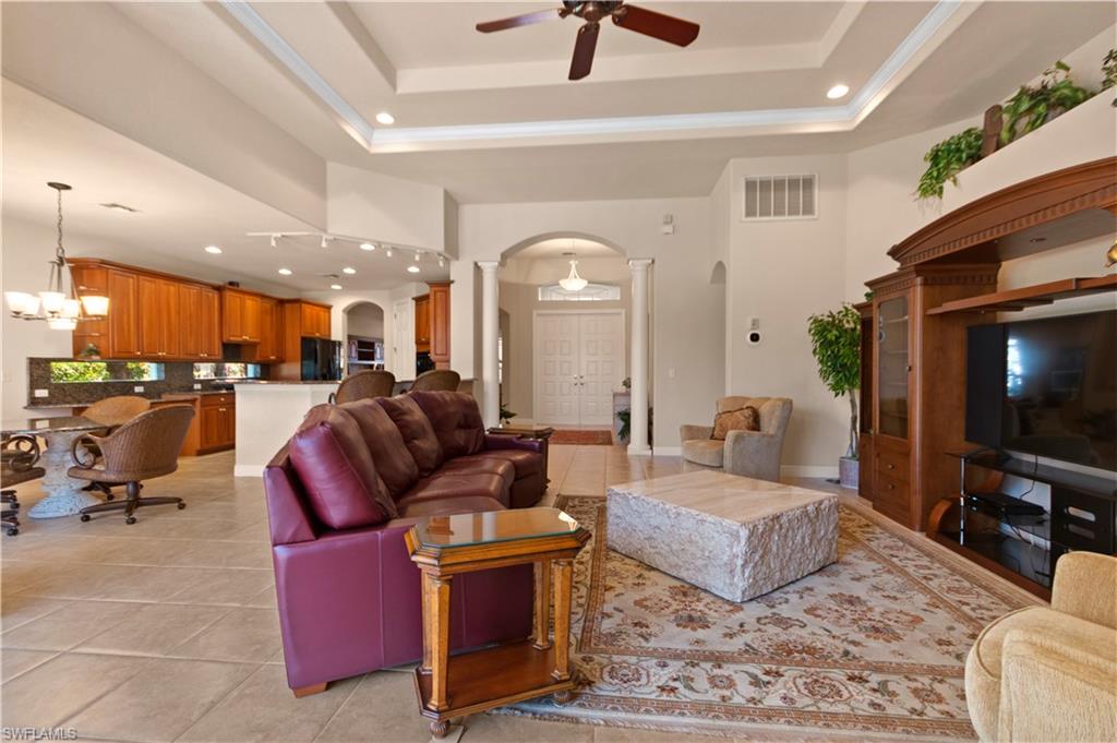 8855 Largo Mar Drive Estero, FL 33967 - Photo 9 of 50 a living room with furniture and a flat screen tv
