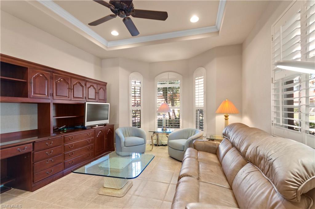 8855 Largo Mar Drive Estero, FL 33967 - Photo 10 of 50 a living room with furniture and a flat screen tv