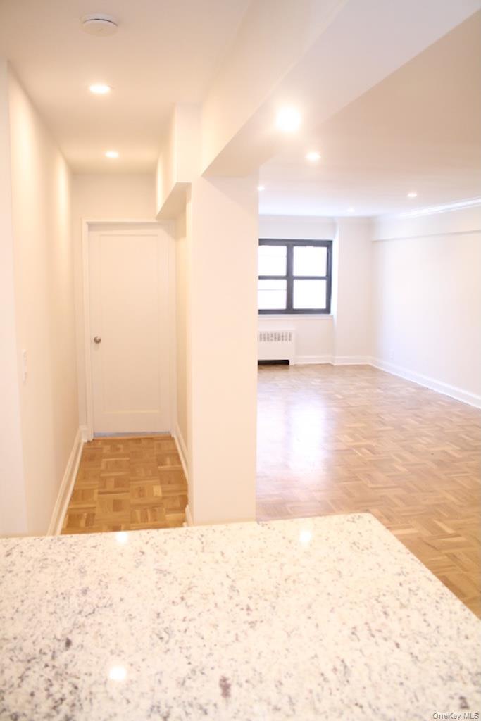 50 White Oak Street, Unit 1C New Rochelle, NY 10801 - Photo 18 of 24 an empty room with windows and cabinet