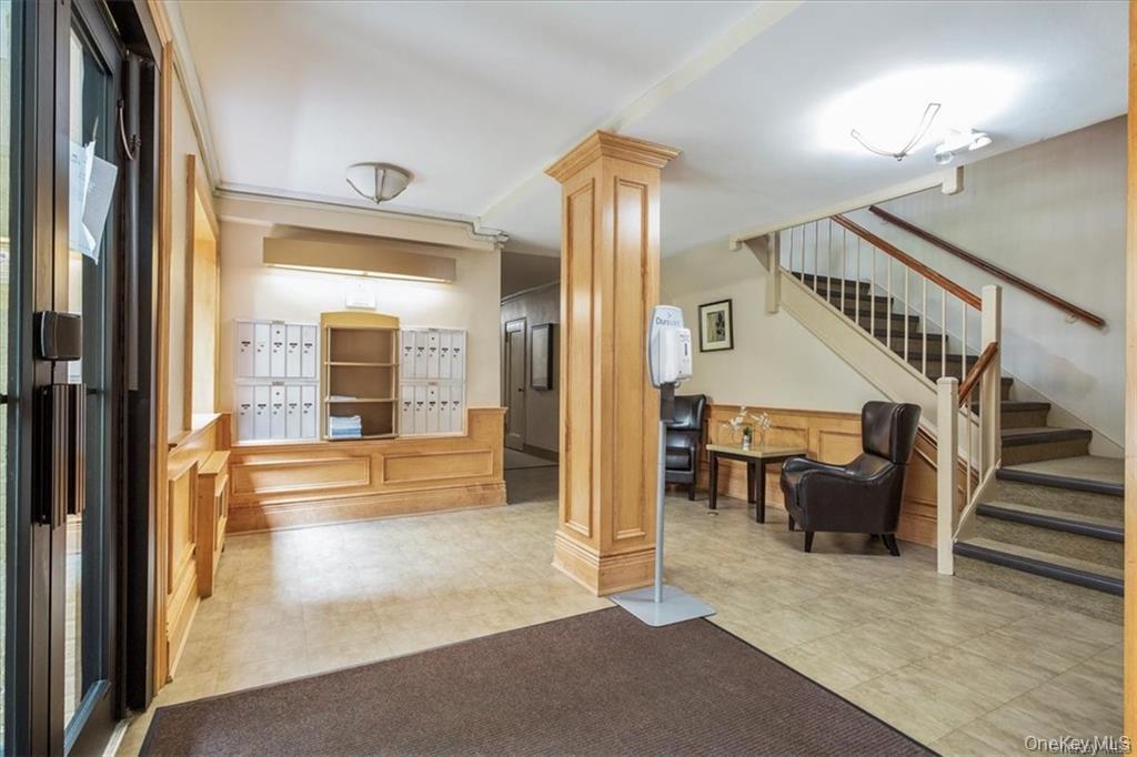 50 White Oak Street, Unit 1C New Rochelle, NY 10801 - Photo 22 of 24 a view of a hallway view with staircase and living room