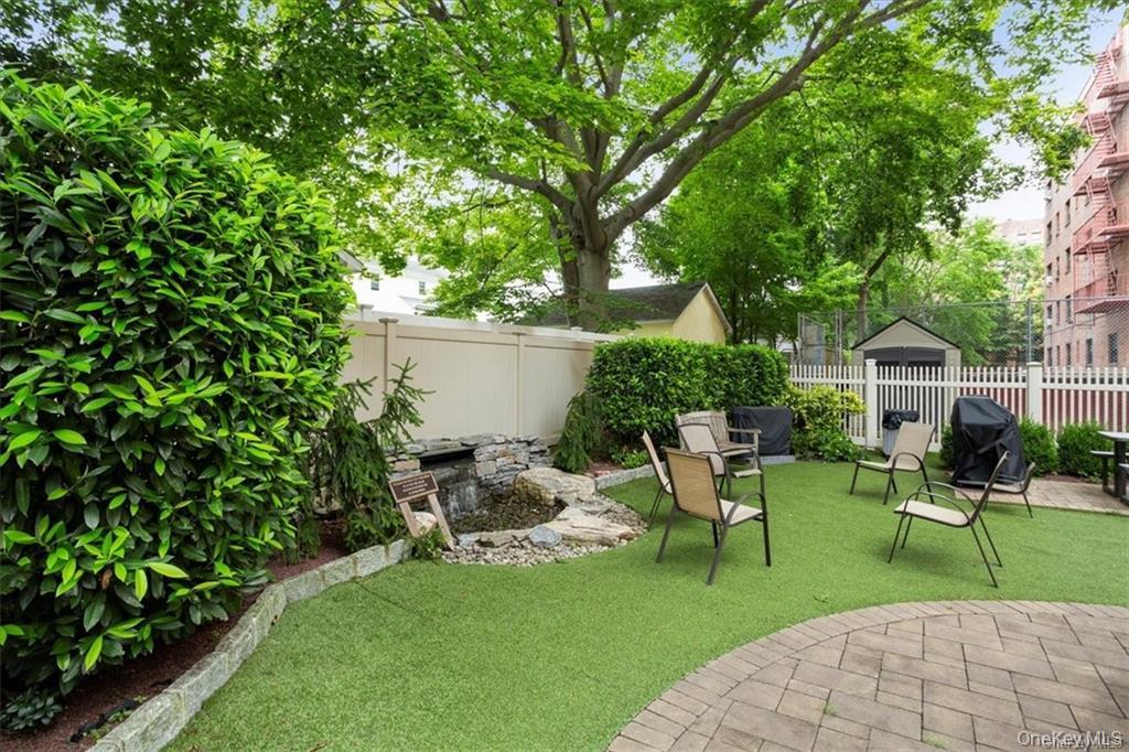 50 White Oak Street, Unit 1C New Rochelle, NY 10801 - Photo 23 of 24 a view of a patio in backyard