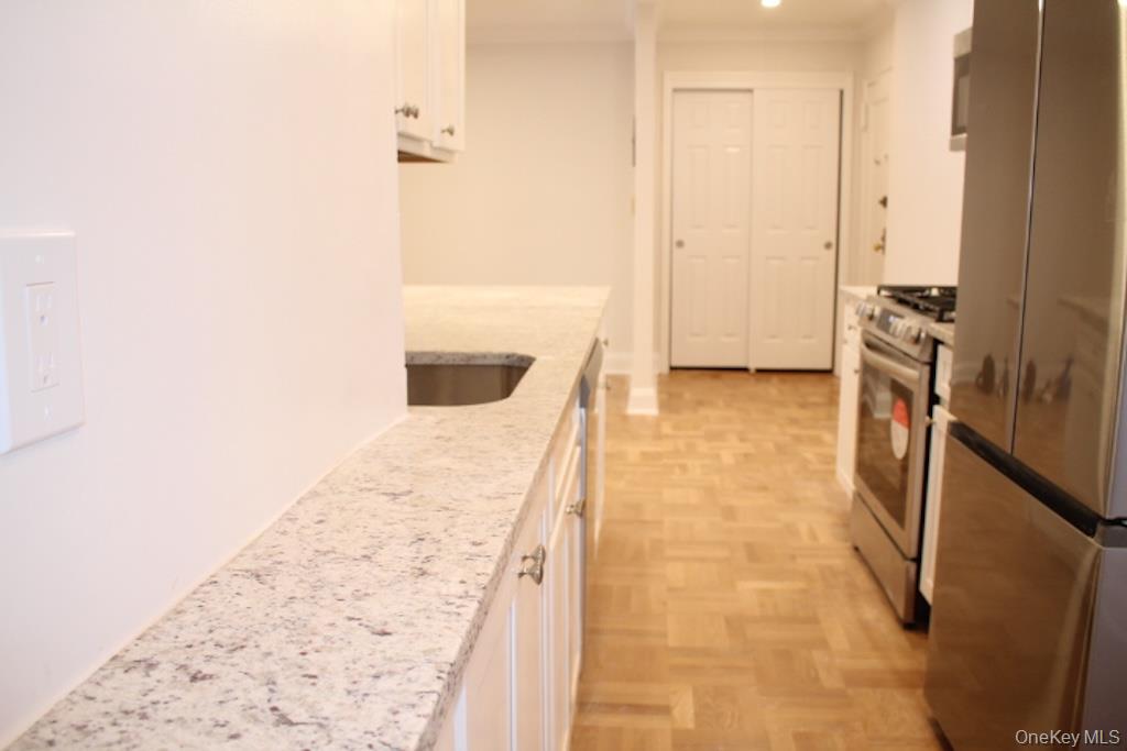 50 White Oak Street, Unit 1C New Rochelle, NY 10801 - Photo 9 of 24 a bathroom with a tub and a shower