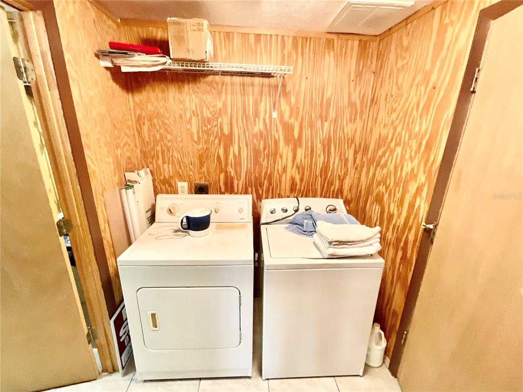 5124 Trouble Creek Road New Port Richey, FL 34652 - Photo 14 of 32 a utility room with a washer dryer and washer