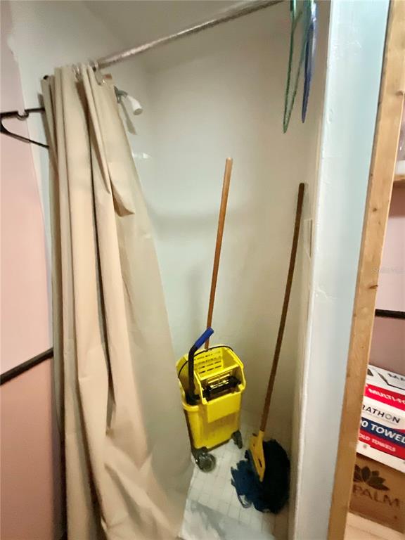 5124 Trouble Creek Road New Port Richey, FL 34652 - Photo 16 of 32 a bathroom with a sink and mirror