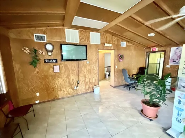 a view of a house with a big yard and garden