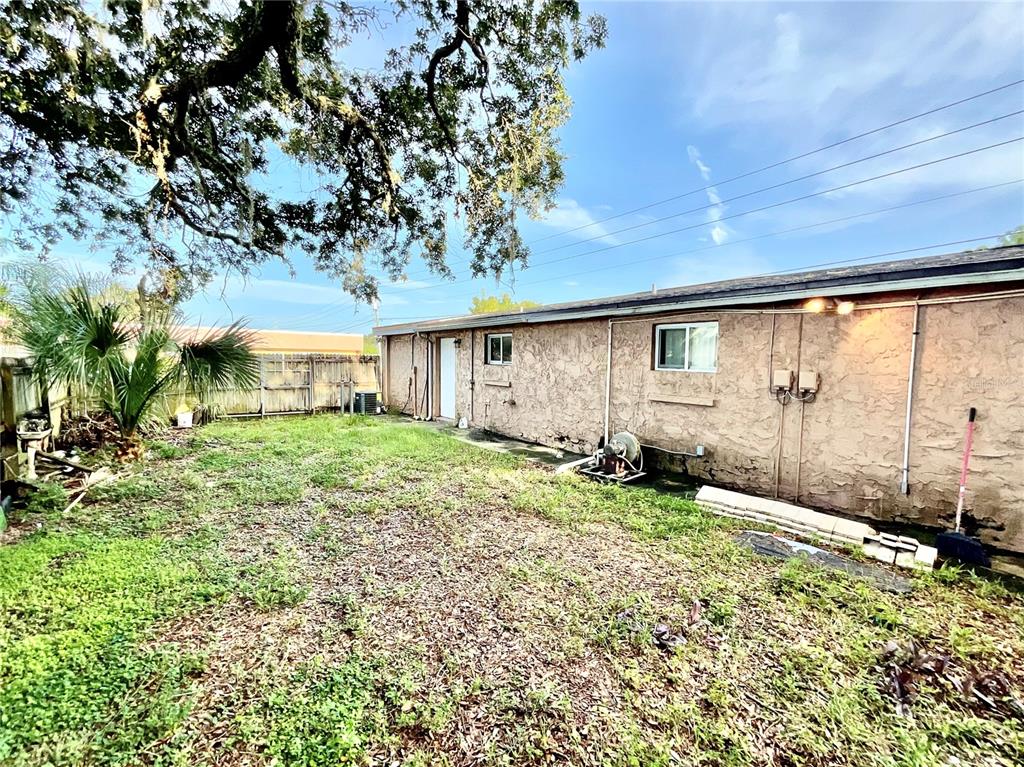 5124 Trouble Creek Road New Port Richey, FL 34652 - Photo 19 of 32 a view of a house with a big yard and garden