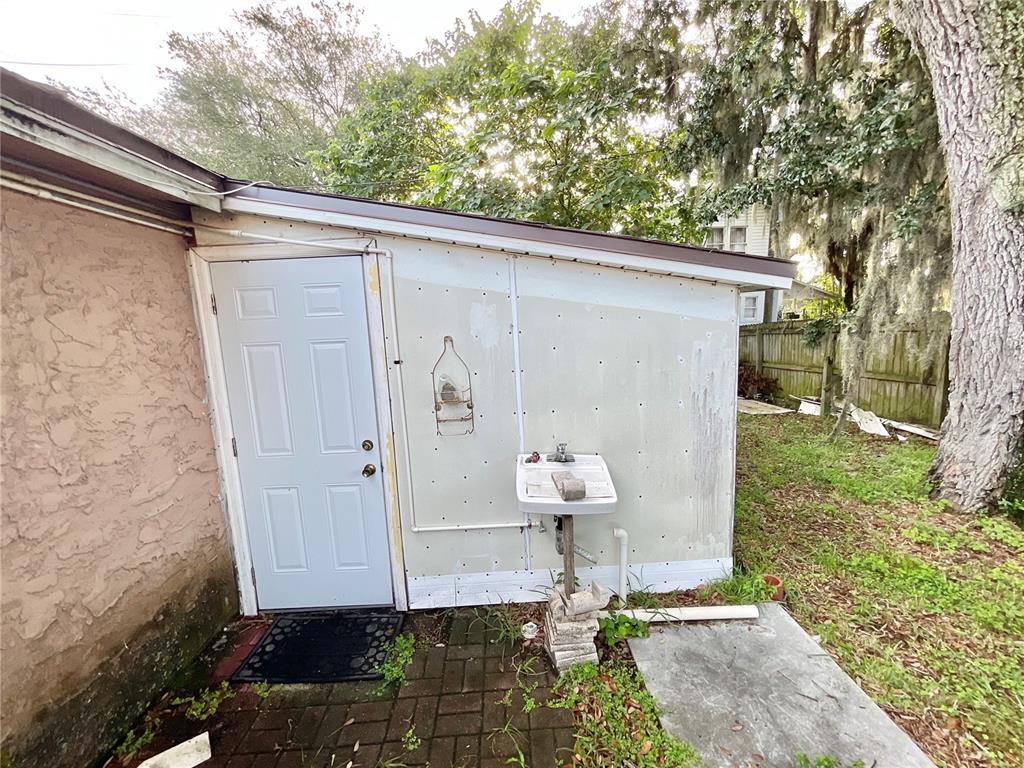 5124 Trouble Creek Road New Port Richey, FL 34652 - Photo 20 of 32 a front view of a house with garden