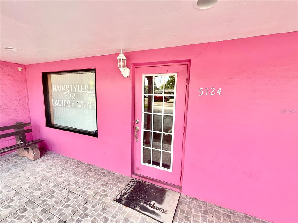 5124 Trouble Creek Road New Port Richey, FL 34652 - Photo 2 of 32 a view of a red brick wall with window in front of it