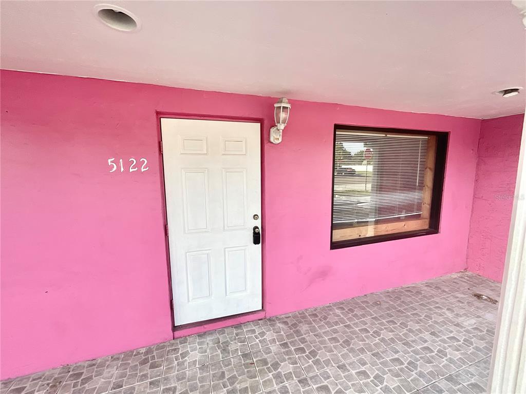 5124 Trouble Creek Road New Port Richey, FL 34652 - Photo 21 of 32 a view of a red door