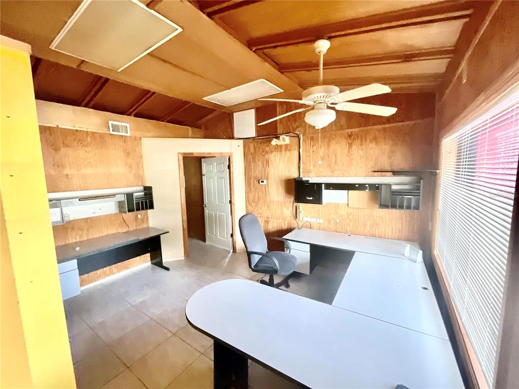 5124 Trouble Creek Road New Port Richey, FL 34652 - Photo 22 of 32 a living room with furniture and a window