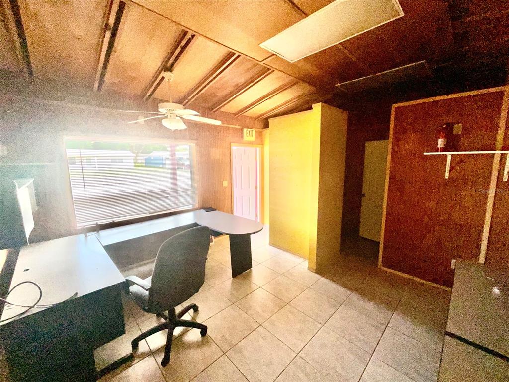 5124 Trouble Creek Road New Port Richey, FL 34652 - Photo 23 of 32 a view of a room with wooden floor and windows