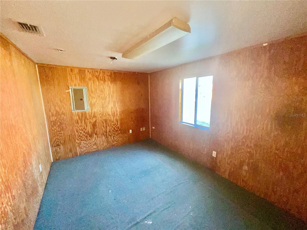 5124 Trouble Creek Road New Port Richey, FL 34652 - Photo 28 of 32 a view of an empty room with a window