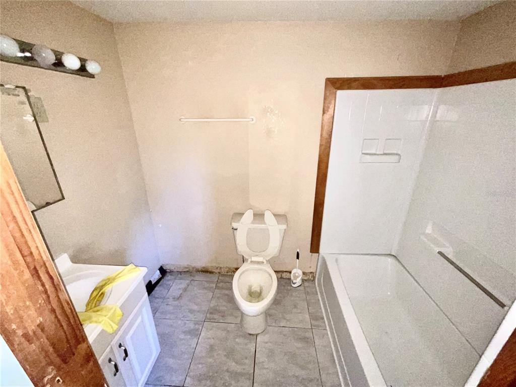 5124 Trouble Creek Road New Port Richey, FL 34652 - Photo 30 of 32 a bathroom with a toilet and a shower