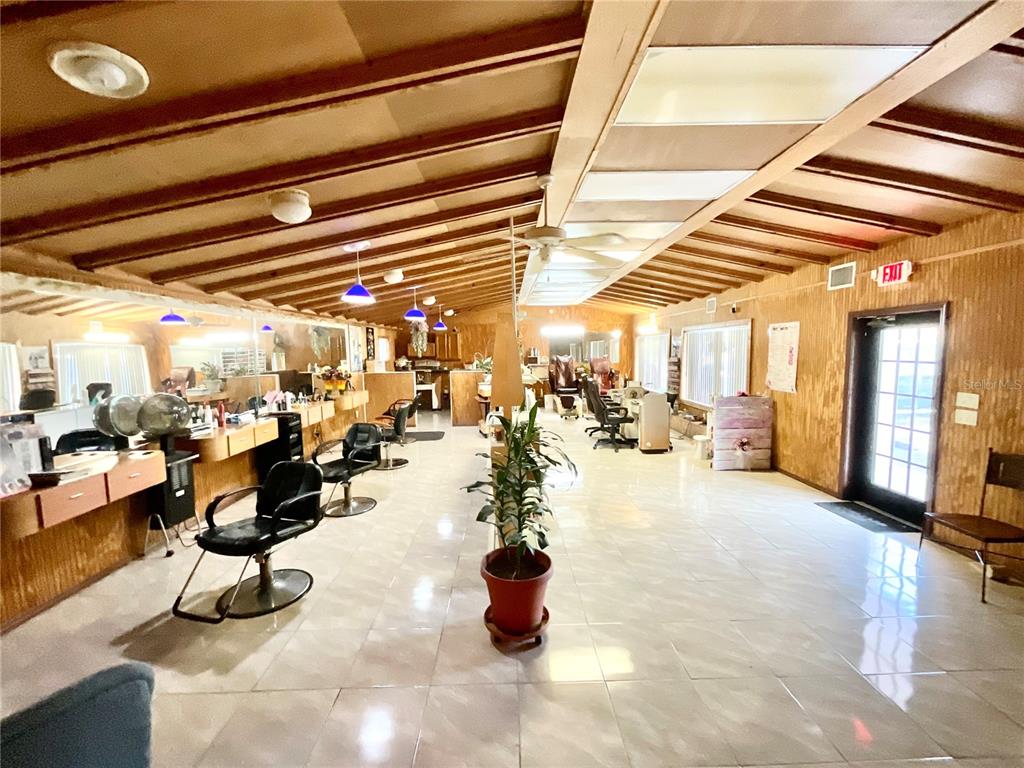 5124 Trouble Creek Road New Port Richey, FL 34652 - Photo 3 of 32 a group of people sitting in a room