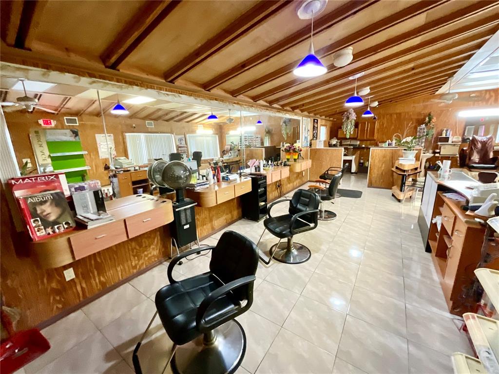 5124 Trouble Creek Road New Port Richey, FL 34652 - Photo 4 of 32 a group of people sitting in a room