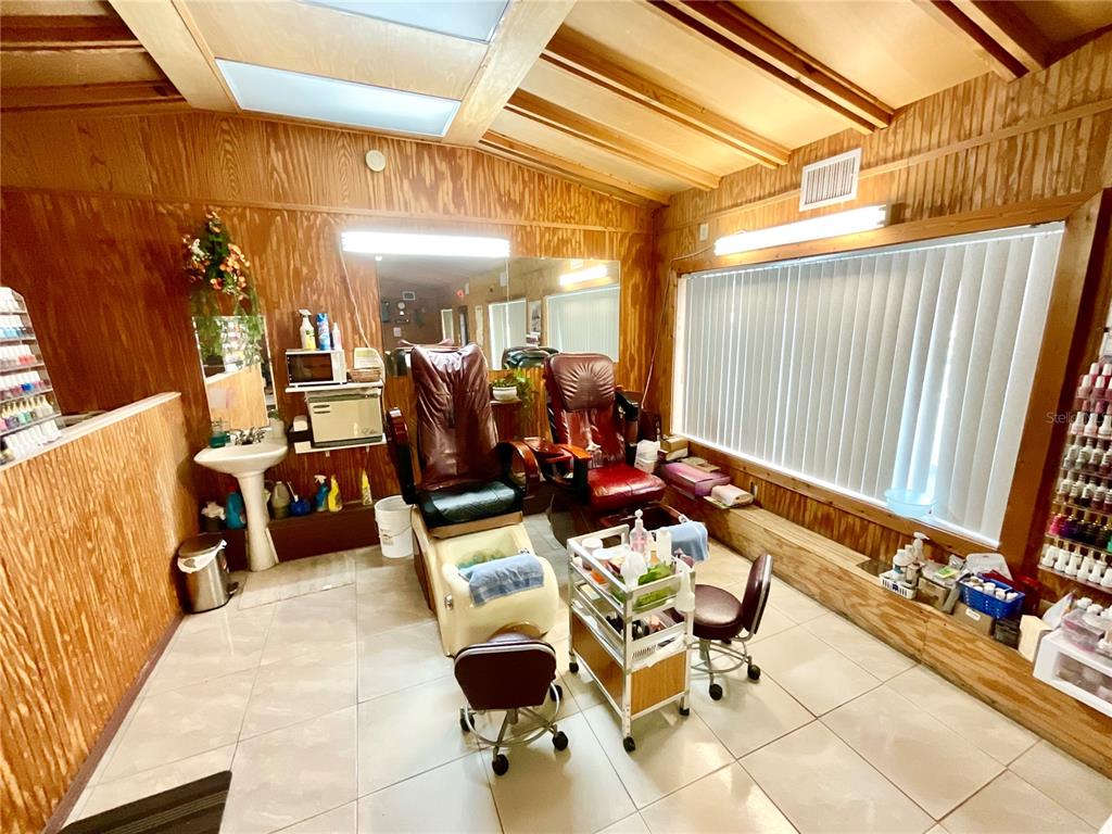 5124 Trouble Creek Road New Port Richey, FL 34652 - Photo 7 of 32 a view of a dinning tables and chairs in the patio