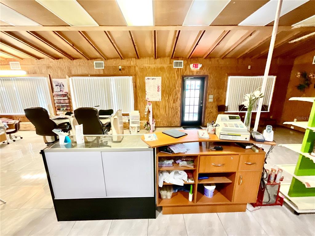 5124 Trouble Creek Road New Port Richey, FL 34652 - Photo 9 of 32 a living room with a couch and a table