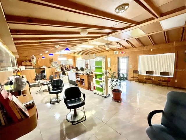 a lobby with furniture and floor to ceiling window