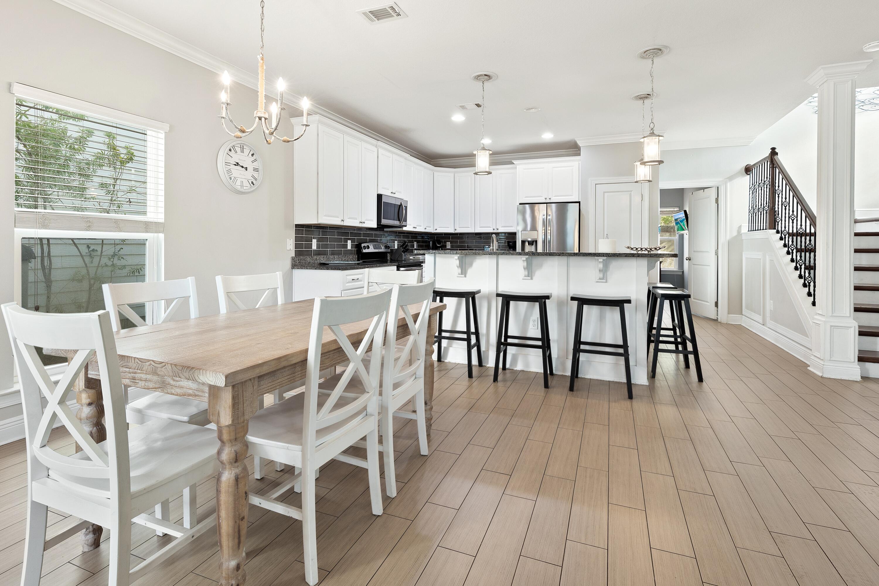 207 Kono Way Destin, FL 32541 - Photo 11 of 45 a view of a dining room with furniture and wooden floor