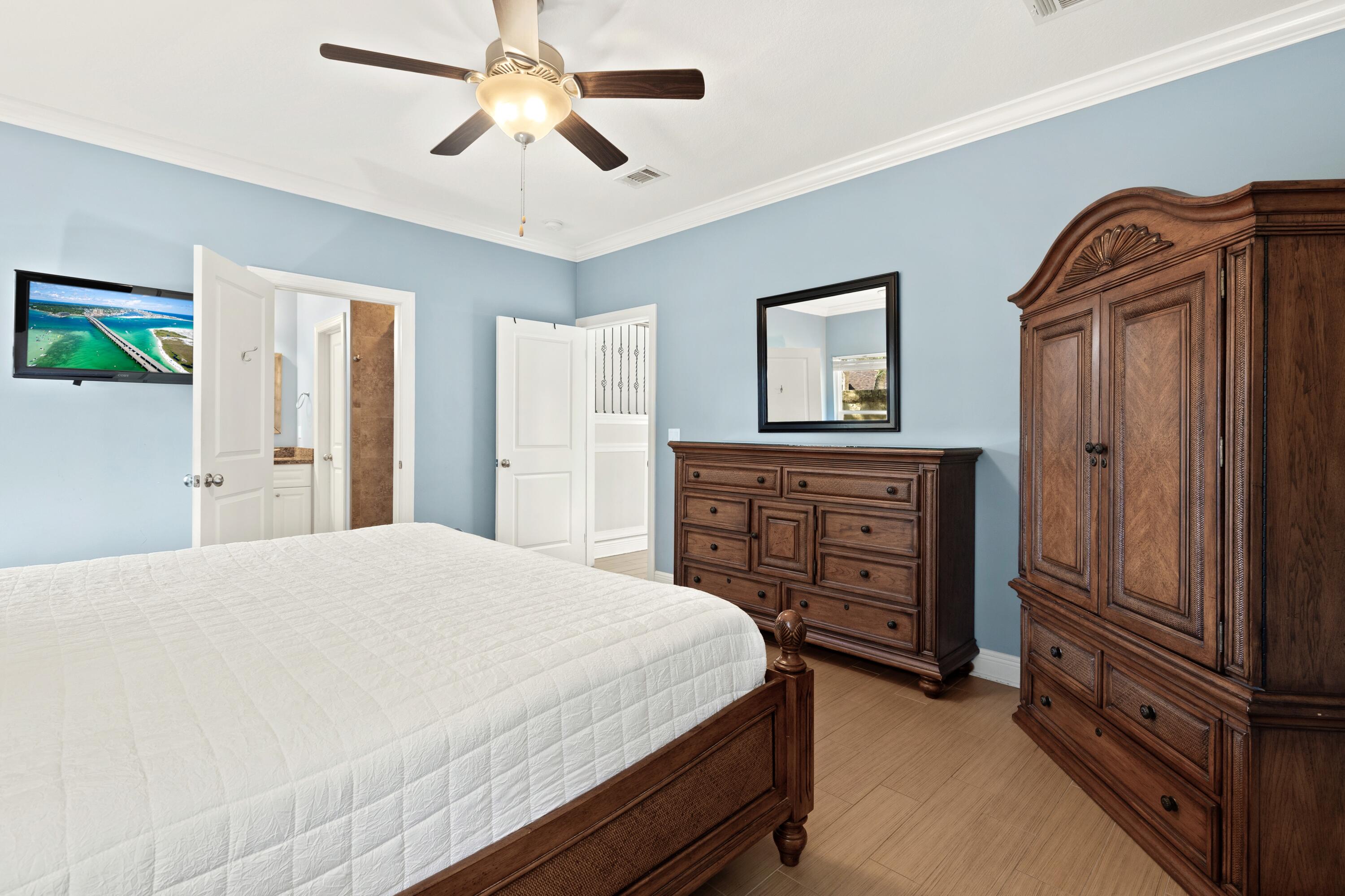 207 Kono Way Destin, FL 32541 - Photo 17 of 45 a bedroom with a bed dresser and a window