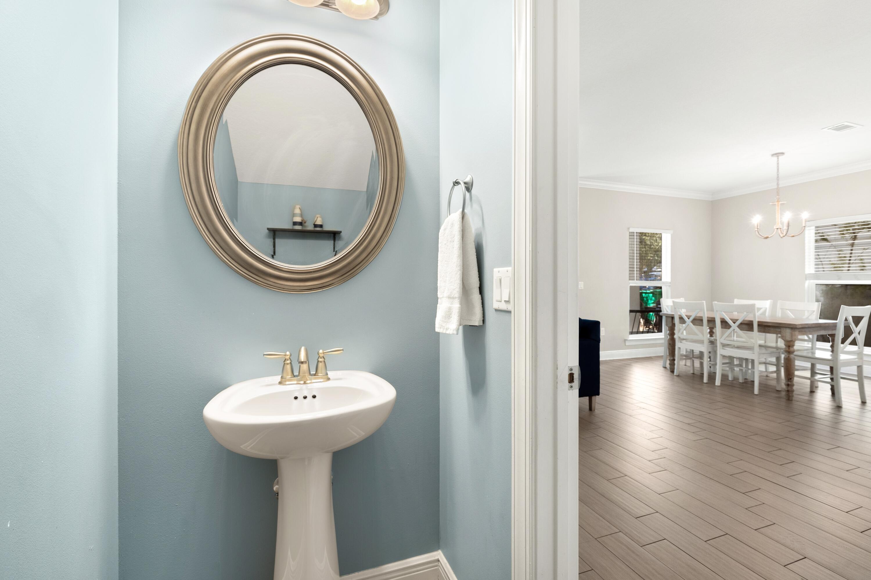 207 Kono Way Destin, FL 32541 - Photo 20 of 45 a bathroom with a sink and a mirror