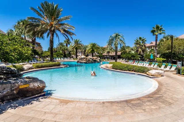 a view of a swimming pool with a lounge chair