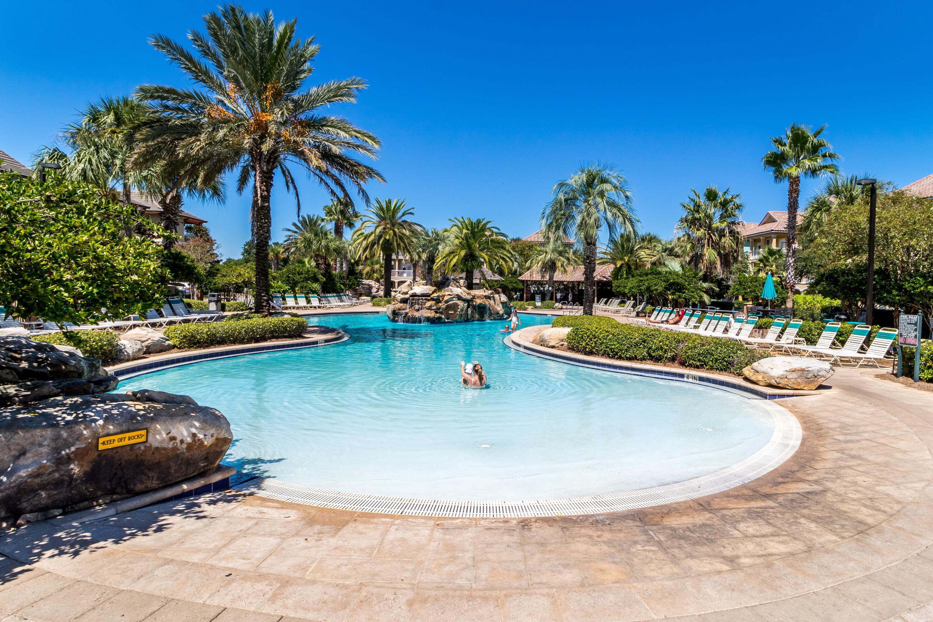 207 Kono Way Destin, FL 32541 - Photo 3 of 45 a view of a swimming pool with a lounge chair