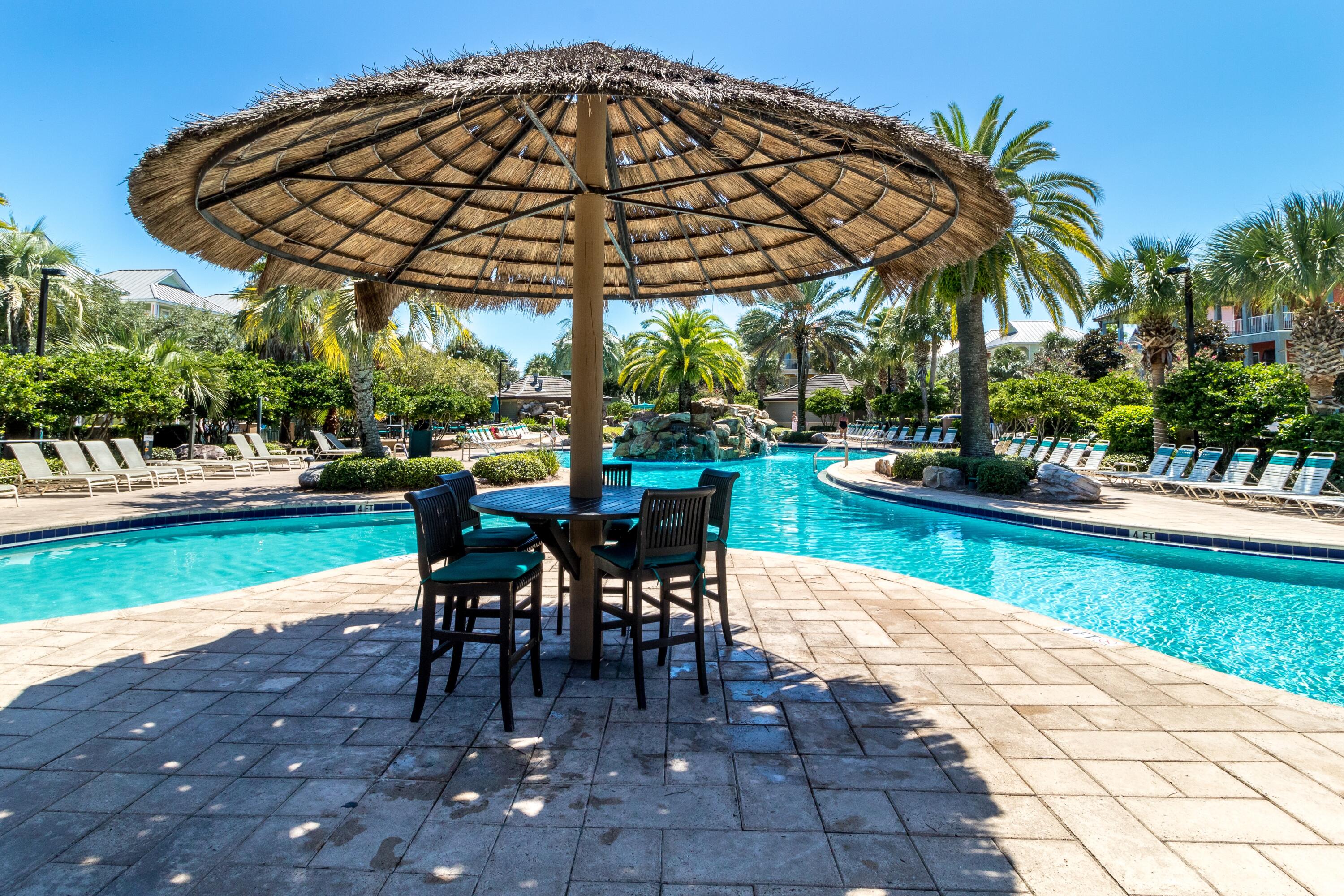 207 Kono Way Destin, FL 32541 - Photo 37 of 45 a view of a patio with a table and chairs under an umbrella
