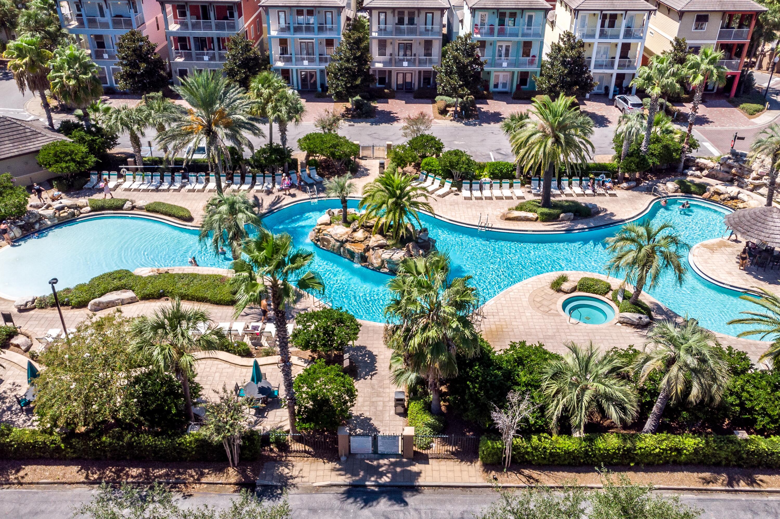 207 Kono Way Destin, FL 32541 - Photo 38 of 45 a view of a swimming pool with a table and chairs in a patio