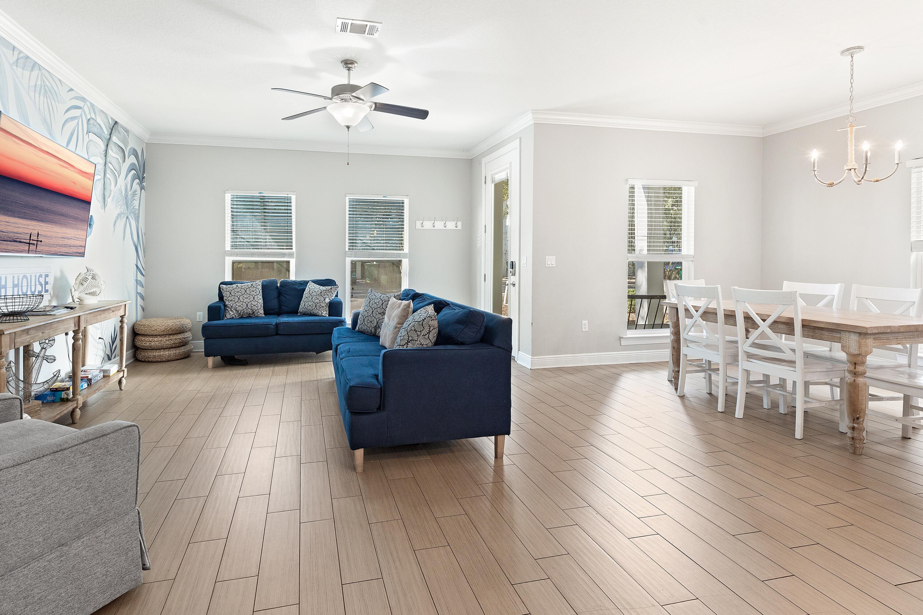 207 Kono Way Destin, FL 32541 - Photo 8 of 45 a living room with furniture and a chandelier