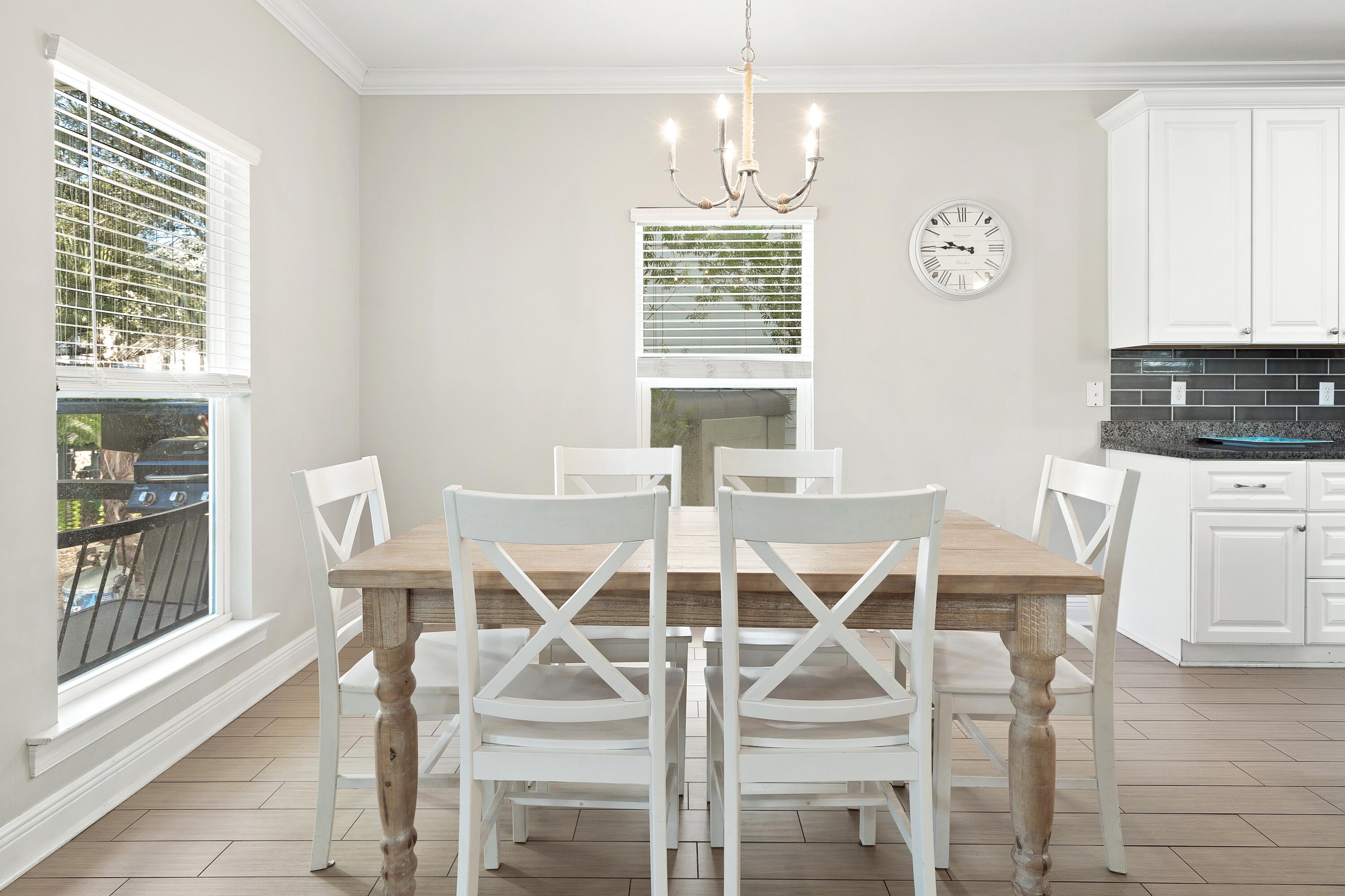 207 Kono Way Destin, FL 32541 - Photo 10 of 45 a view of a dining room with furniture and chandelier