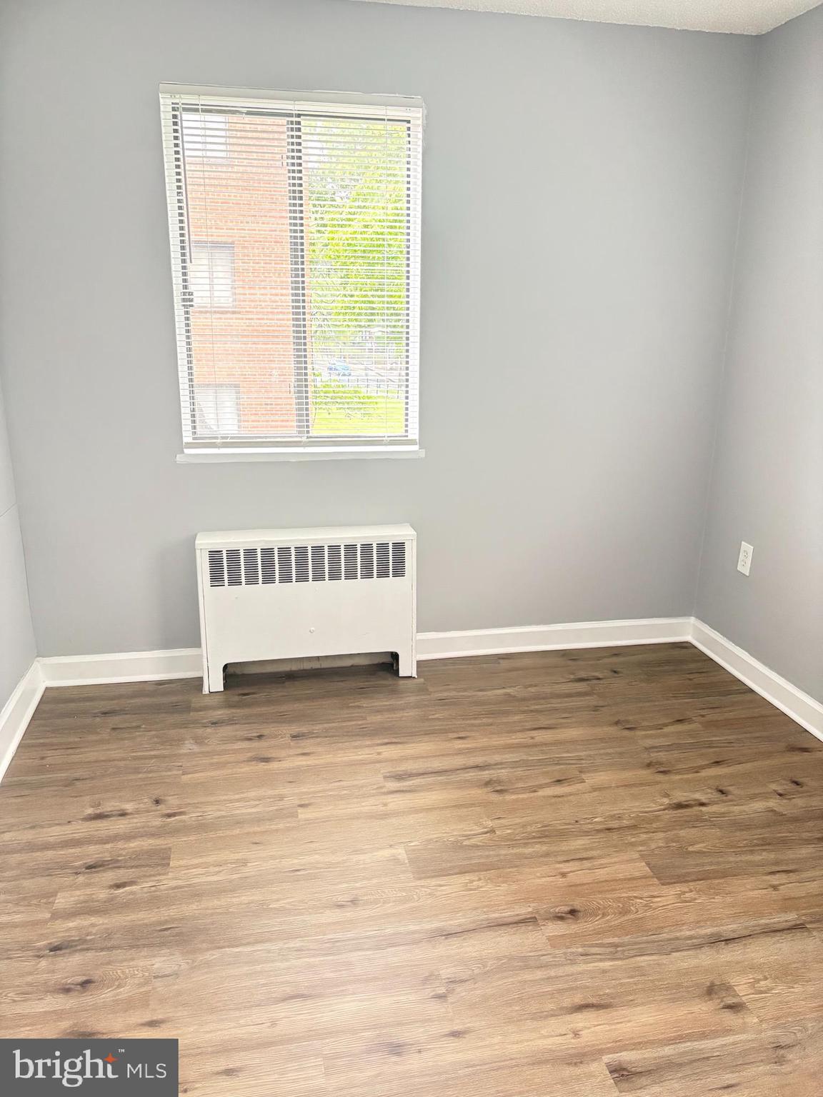 4721 1st Street Southwest, Unit 203 Washington, DC 20032 - Photo 6 of 6 a view of a room with wooden floor and window