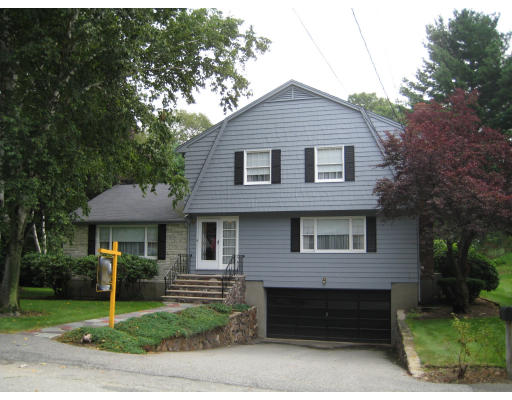 4 Ledgewood Road Woburn, MA 01801 - Photo 1 of 13 a front view of a house with a garden