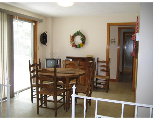 4 Ledgewood Road Woburn, MA 01801 - Photo 12 of 13 a view of a dining room with furniture and chandelier