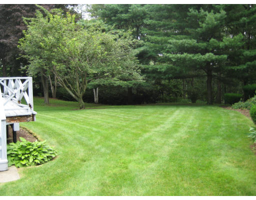 4 Ledgewood Road Woburn, MA 01801 - Photo 6 of 13 a view of a backyard with a garden