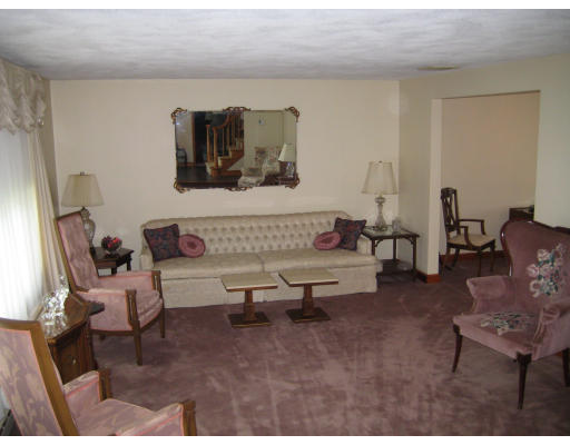 4 Ledgewood Road Woburn, MA 01801 - Photo 7 of 13 a living room with furniture and a table