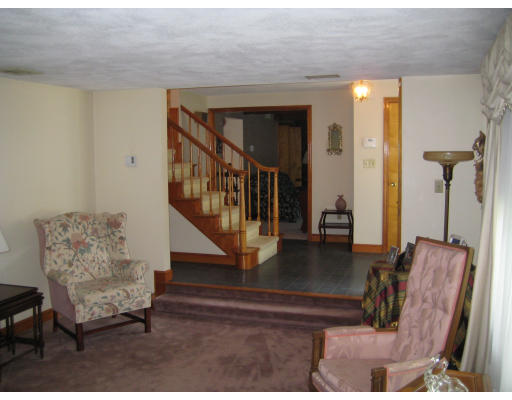 4 Ledgewood Road Woburn, MA 01801 - Photo 9 of 13 a living room with furniture and a stairs