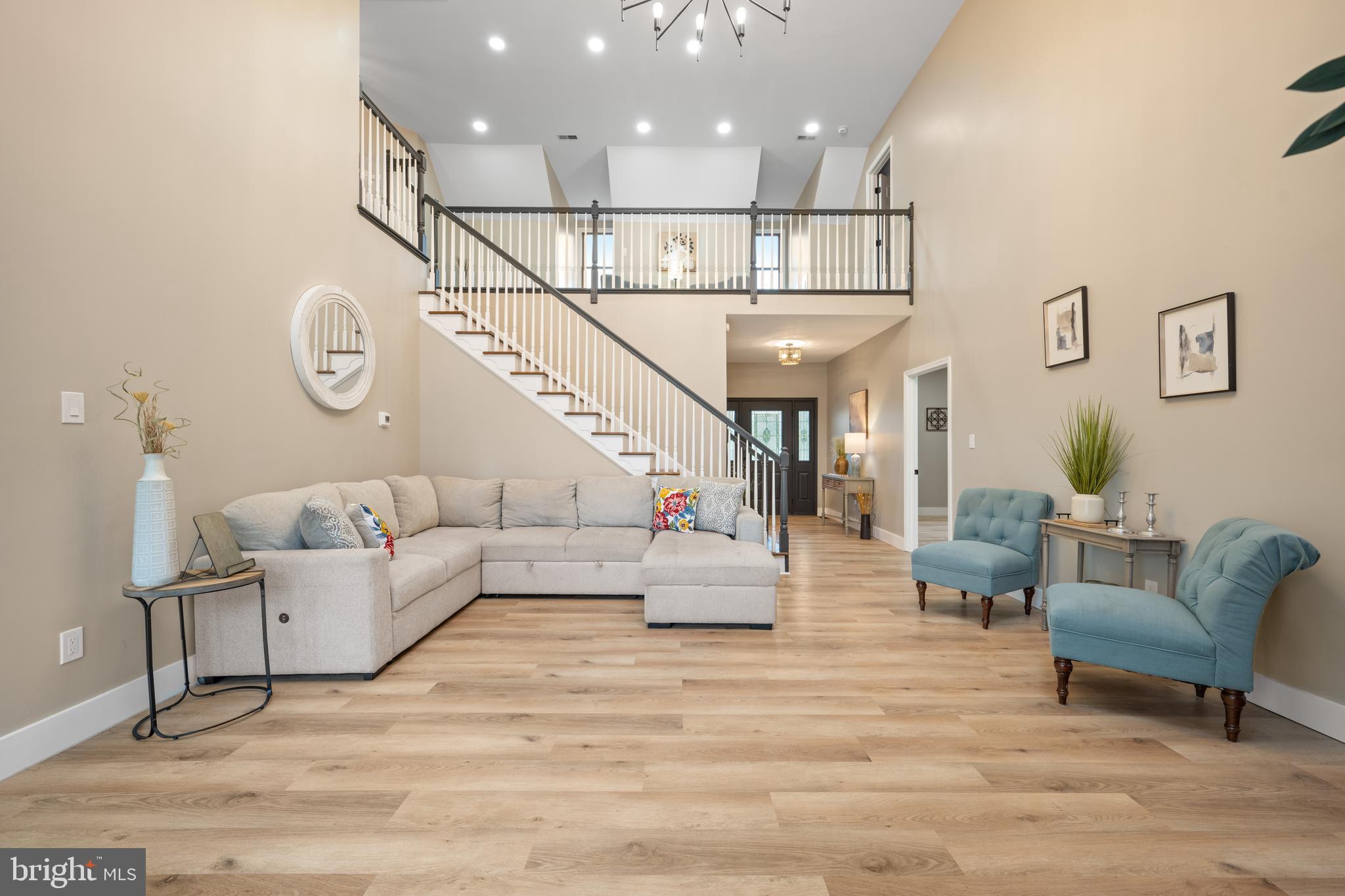 123 West Tomlin Station Road Mickleton, NJ 08056 - Photo 11 of 59 a living room with furniture and a chandelier