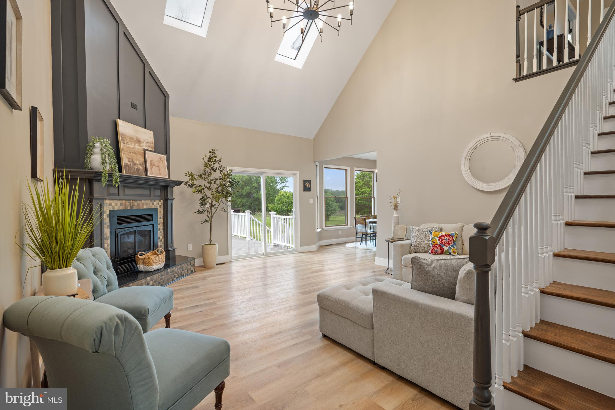 123 West Tomlin Station Road Mickleton, NJ 08056 - Photo 12 of 59 a living room with furniture a fireplace and a large window