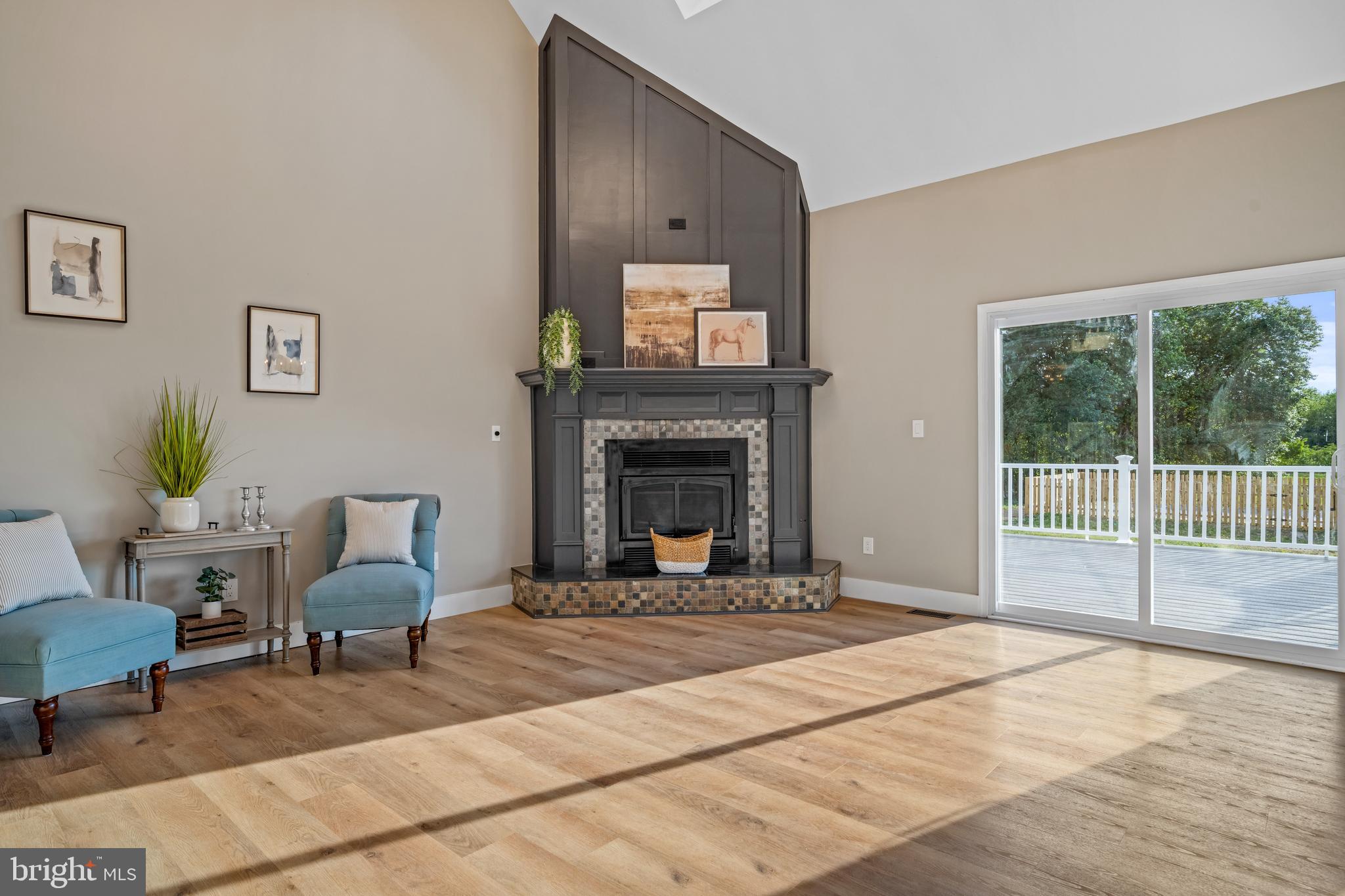 123 West Tomlin Station Road Mickleton, NJ 08056 - Photo 14 of 59 a living room with furniture a window and a fireplace
