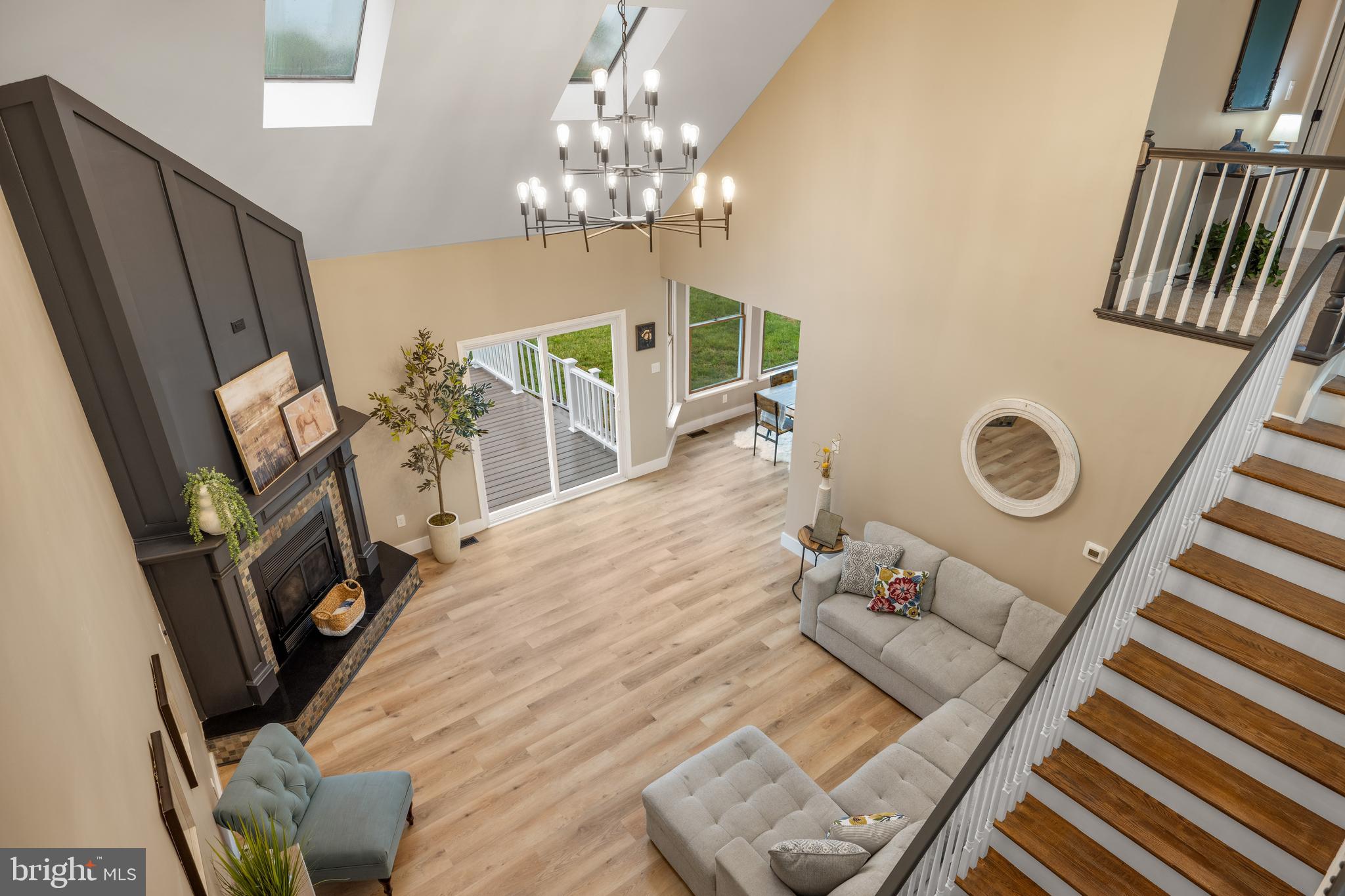 123 West Tomlin Station Road Mickleton, NJ 08056 - Photo 15 of 59 a living room with furniture and a chandelier