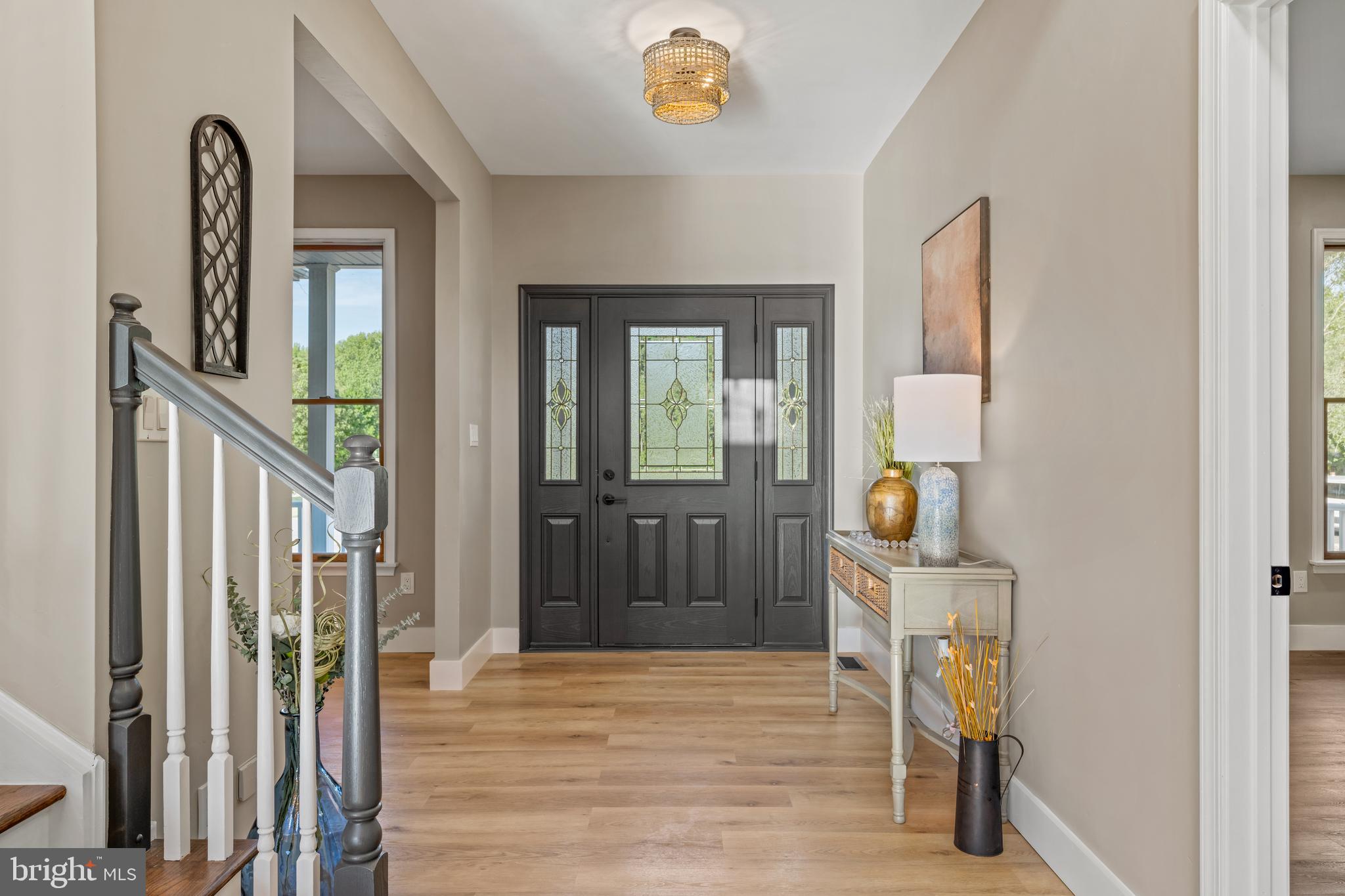 123 West Tomlin Station Road Mickleton, NJ 08056 - Photo 17 of 59 a view of a hallway with wooden floor and a livingroom