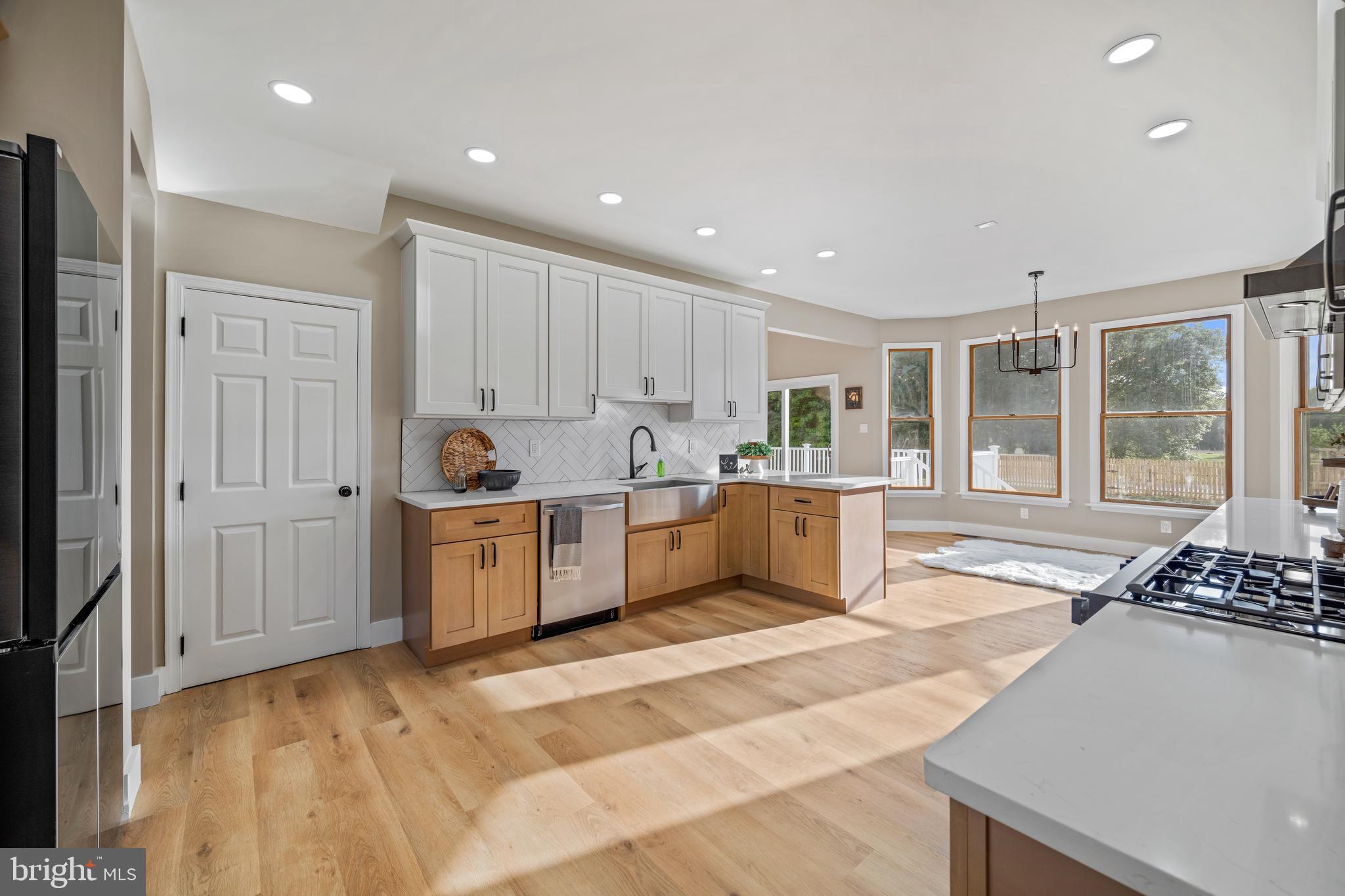 123 West Tomlin Station Road Mickleton, NJ 08056 - Photo 22 of 59 a kitchen with a refrigerator and a stove top oven
