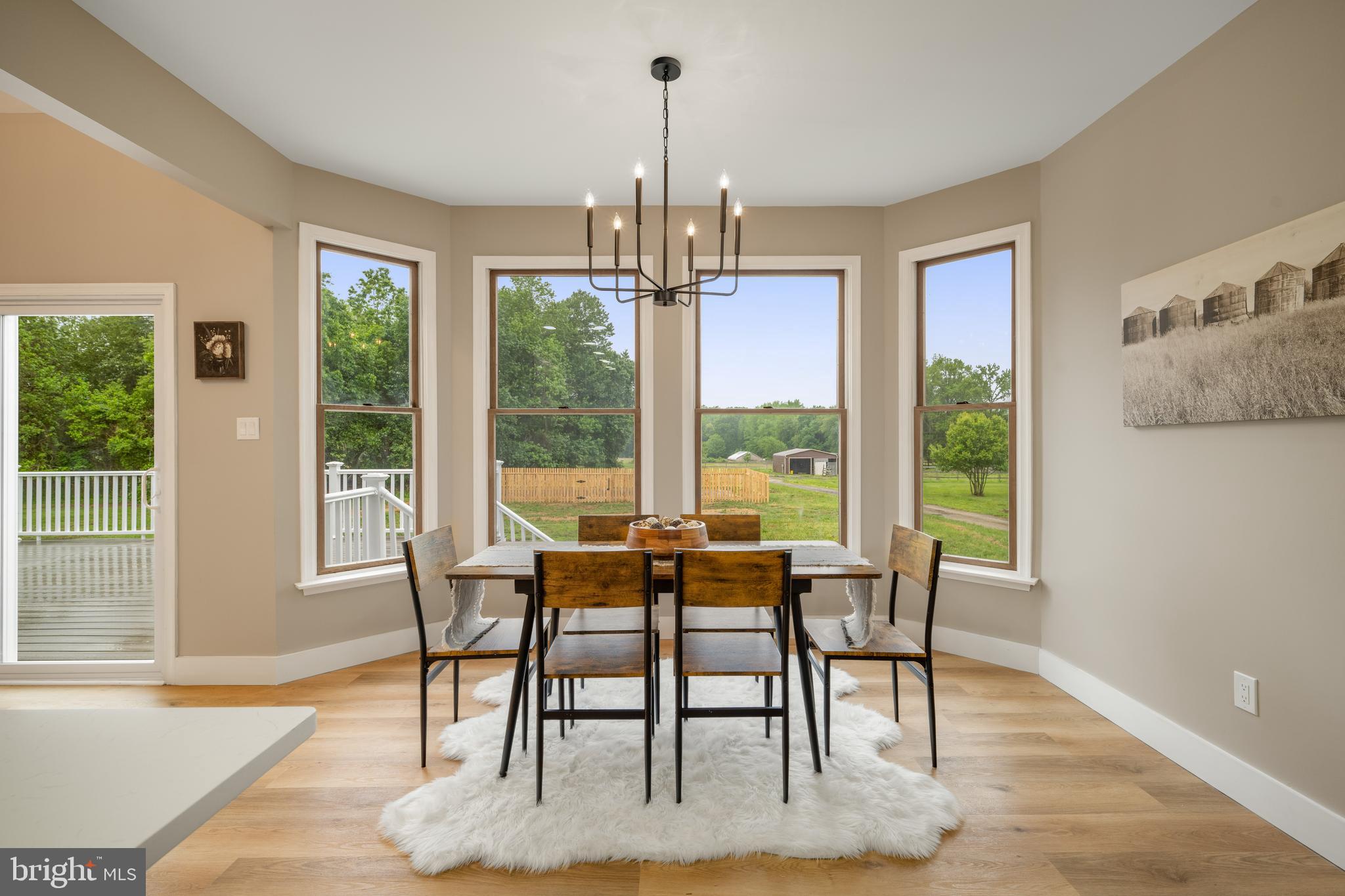 123 West Tomlin Station Road Mickleton, NJ 08056 - Photo 23 of 59 a dining room with furniture a chandelier and wooden floor