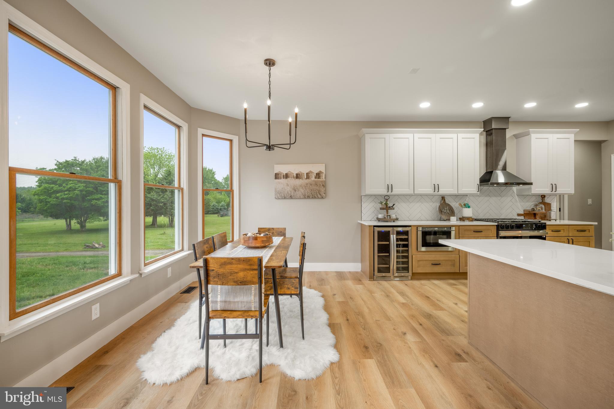 123 West Tomlin Station Road Mickleton, NJ 08056 - Photo 24 of 59 a kitchen with stainless steel appliances kitchen island granite countertop a stove a refrigerator a oven and white cabinets with wooden floors