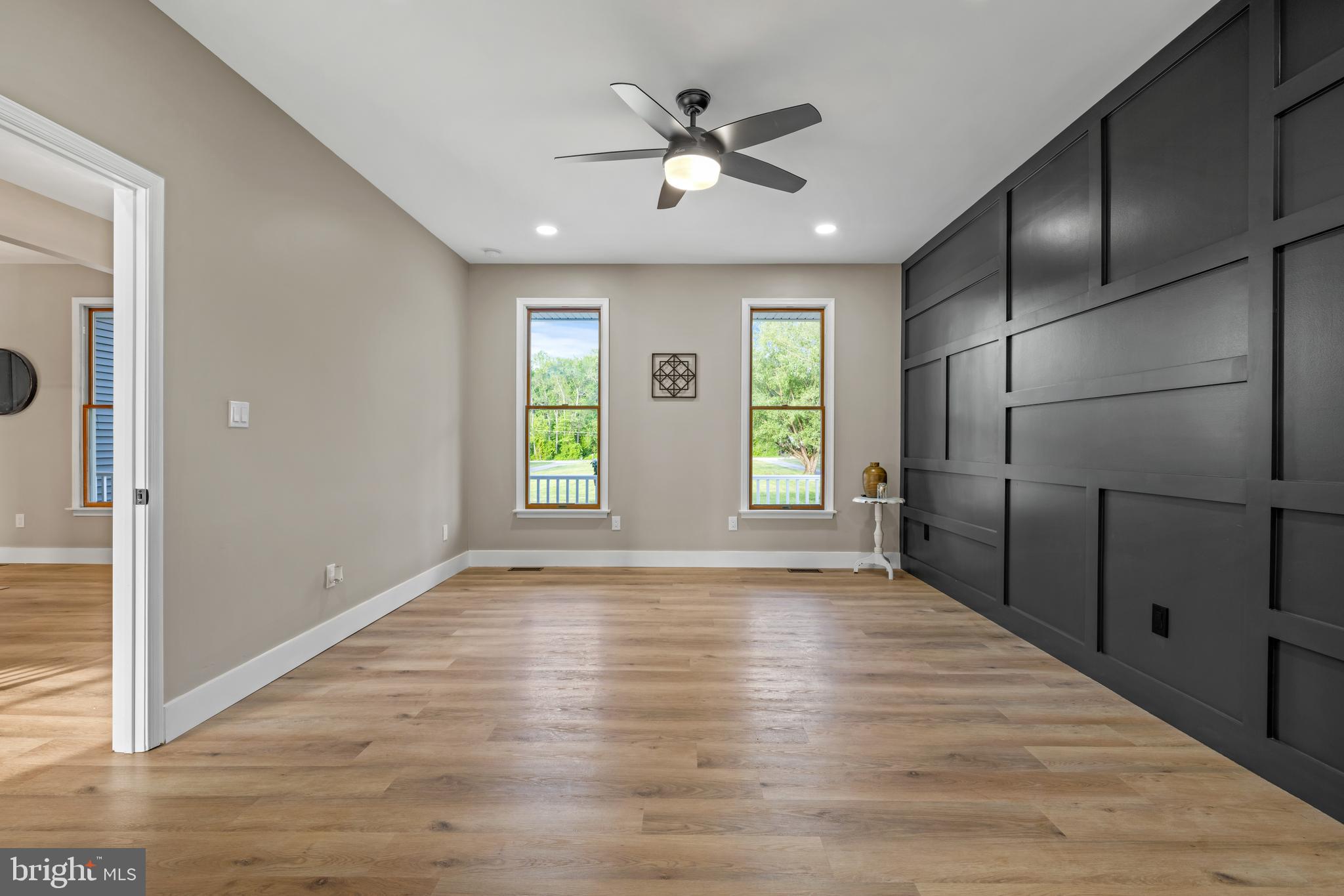 123 West Tomlin Station Road Mickleton, NJ 08056 - Photo 30 of 59 a view of an empty room with wooden floor and a window