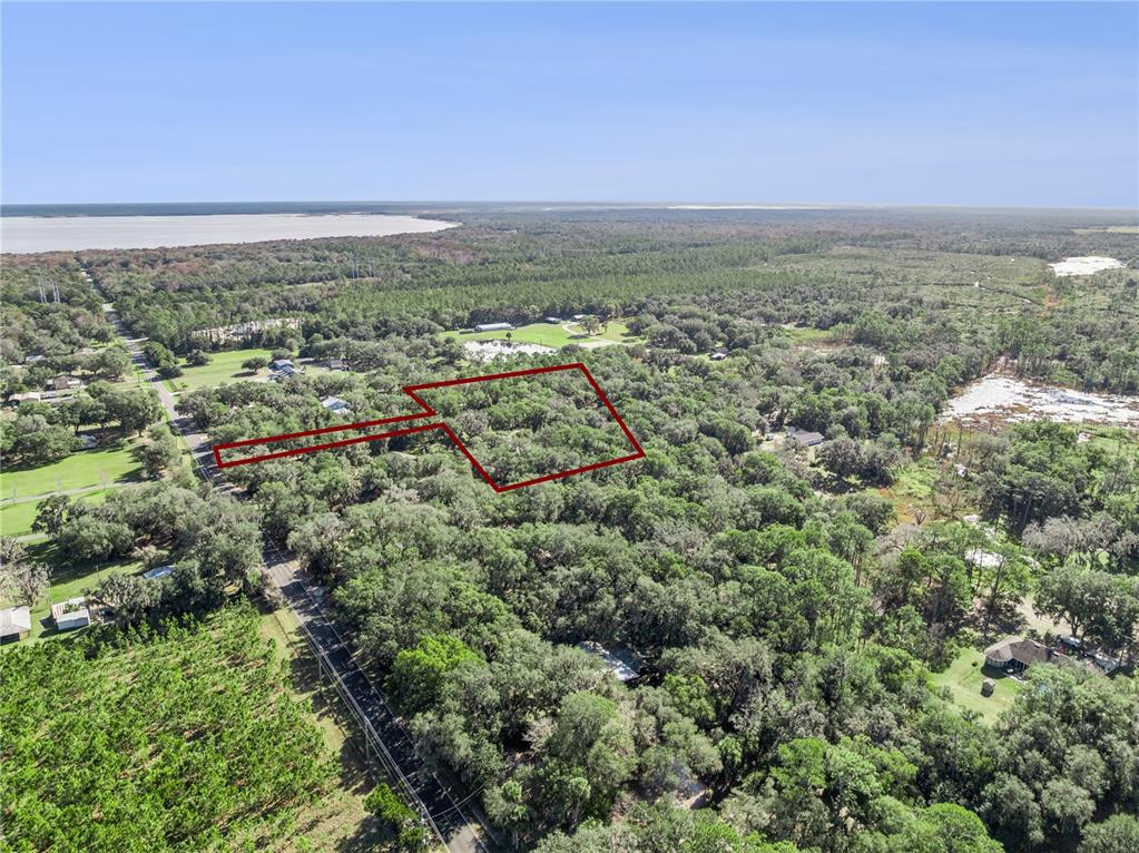 1001 Lake Harney Road Geneva, FL 32732 - Photo 25 of 34 an aerial view of residential building and green space