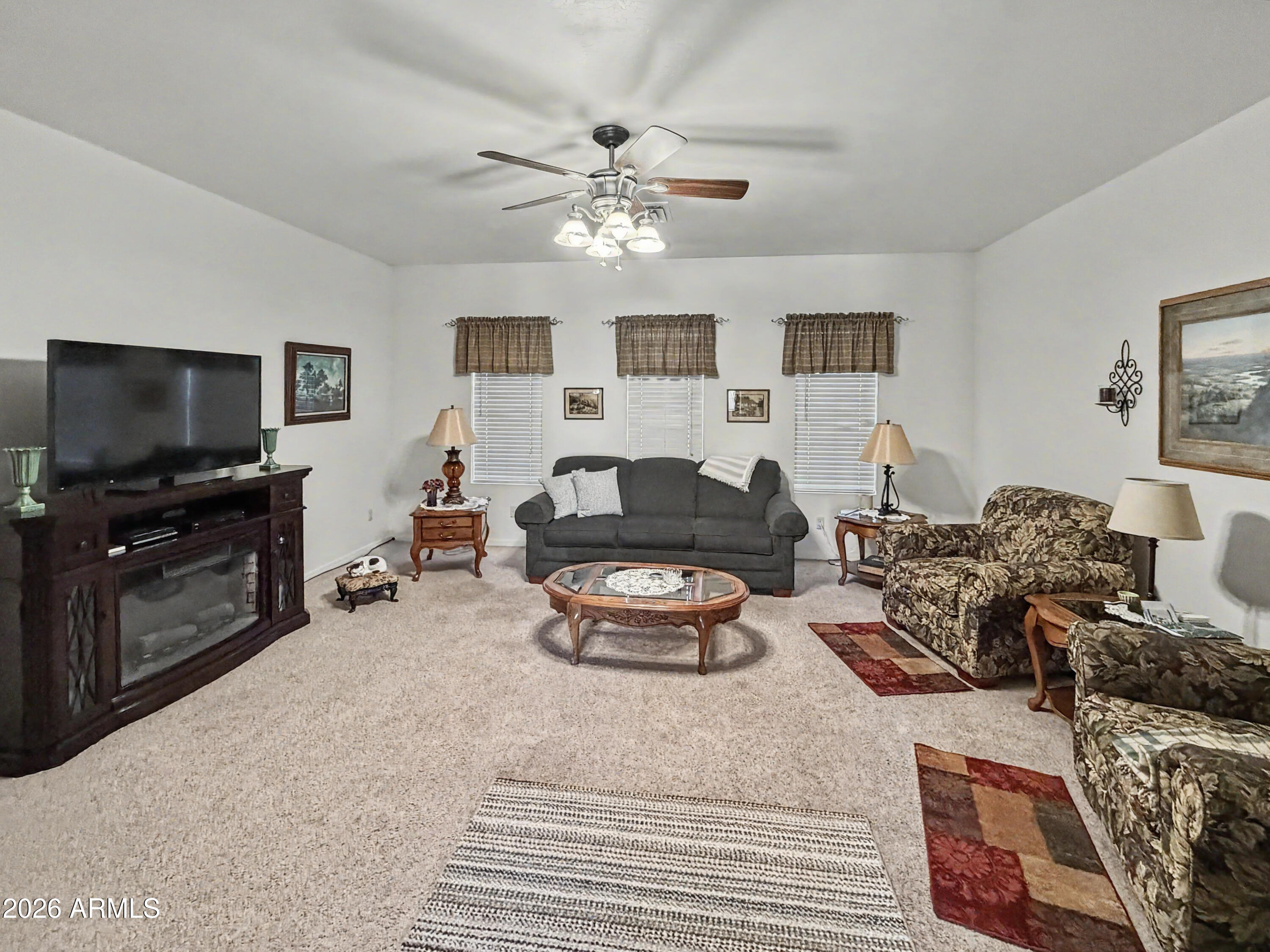2980 Pine Rim Road Heber, AZ 85928 - Photo 9 of 14 a living room with furniture and a flat screen tv